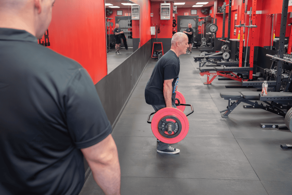 training clients with back pain long island trainers coaching safely